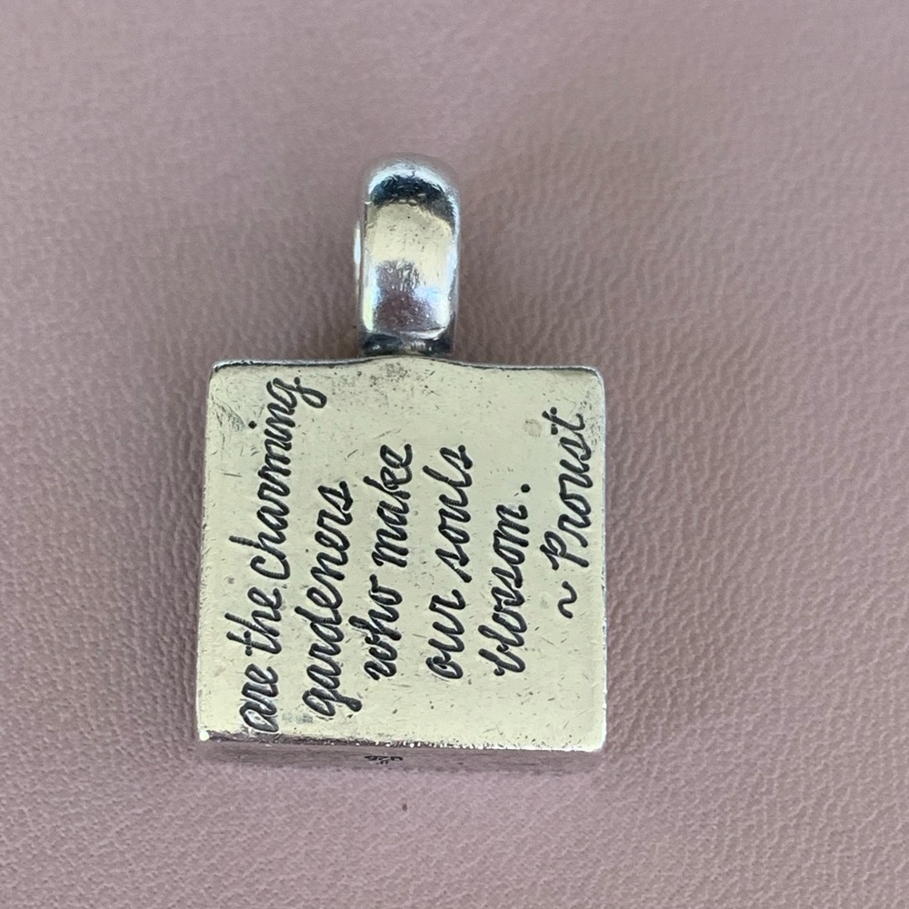 Sterling silver charm.